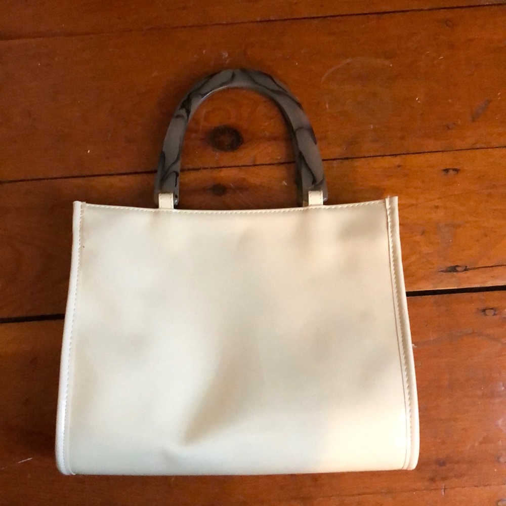 Patent white purse with marbled plastic handles